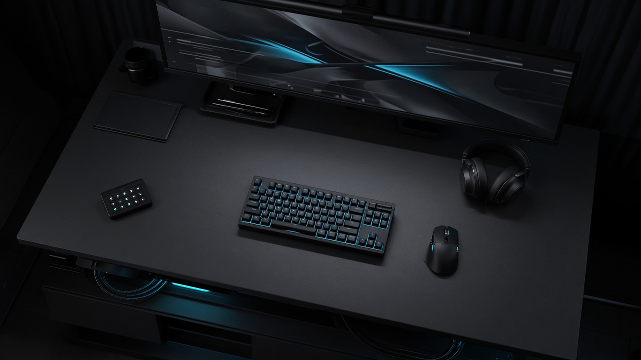 Overhead view of a dark competitive desk with keyboard, mouse, and headset